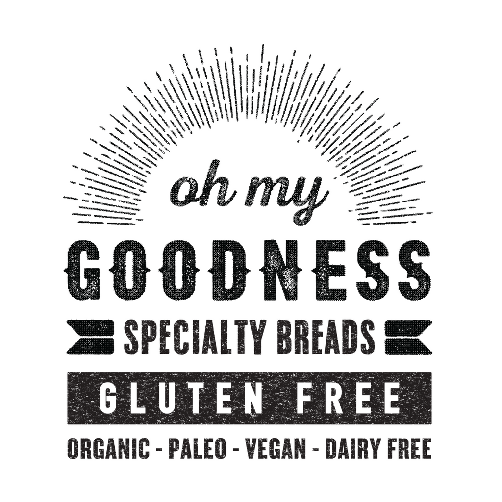 OMG logo in black on white, reads oh my GOODNESS specialty breads, Gluten Free, Organic, Paleo, Vegan, Dairy Free